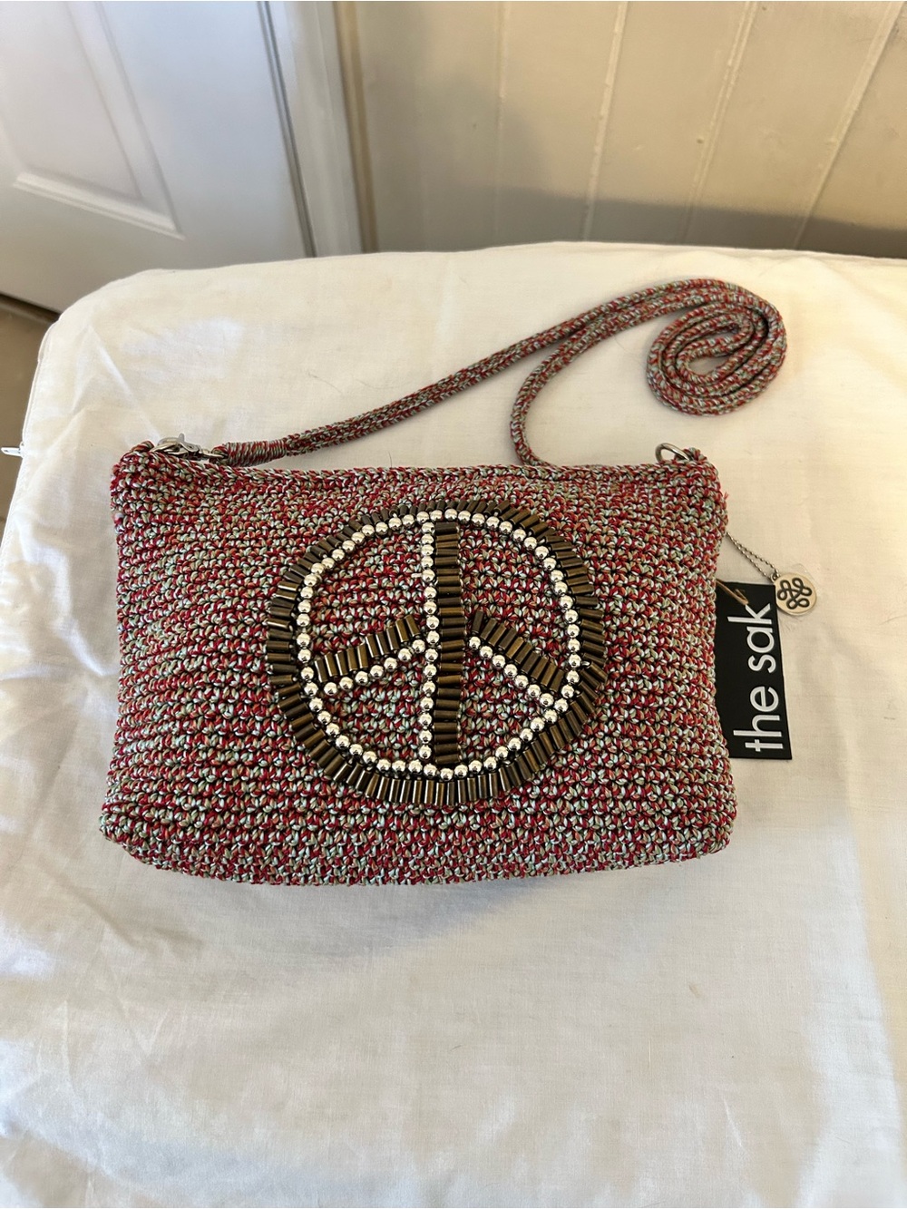 NWT The Sak Lumi Hand Crochet Peace Sign Crossbody Bag